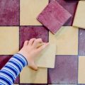 Child's Hand Places The Pieces Of A Checkers Game, Seen From Abo