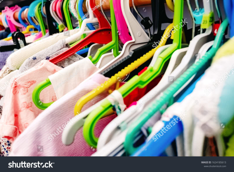 Stock Photo Colorful Children S Dresses Hanging On Hangers In A Closet 1624185613